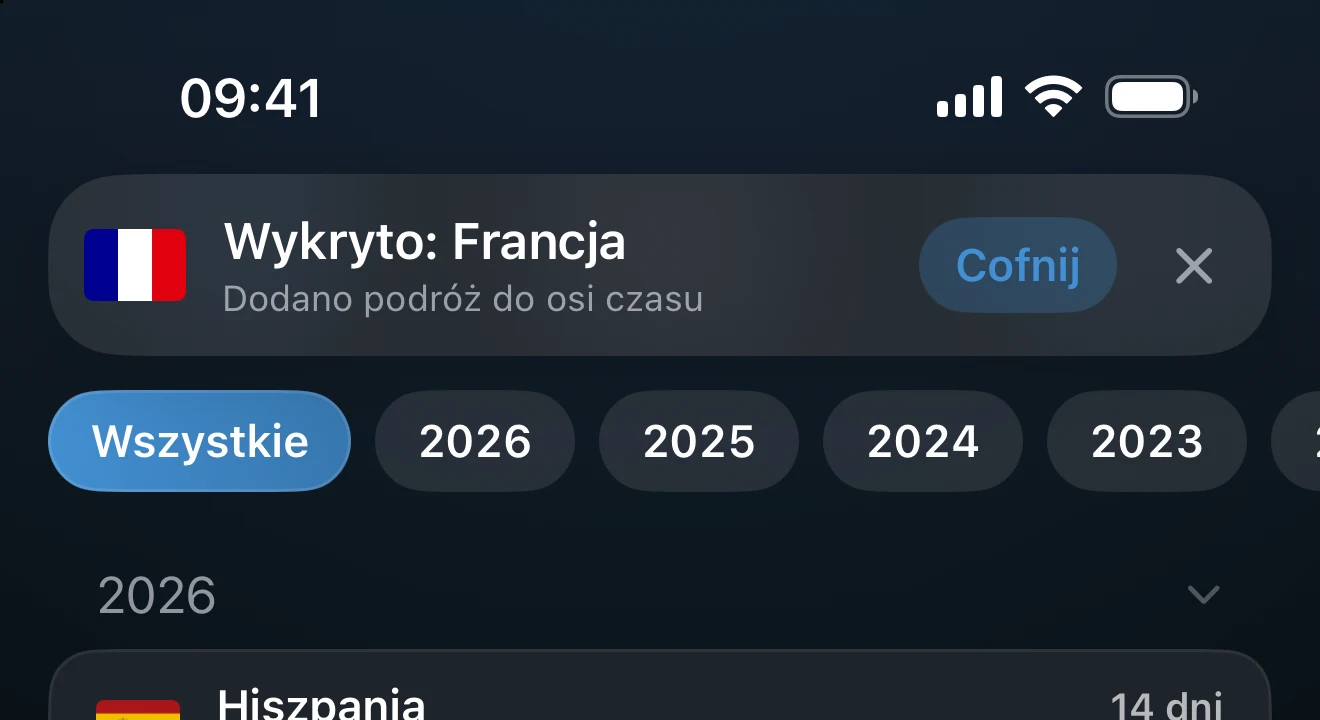 Baner w aplikacji informujący o wykrytym kraju, z przyciskiem Cofnij